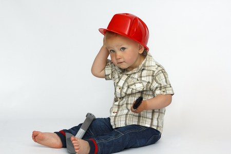 a little boy in a construction hard hatの写真素材