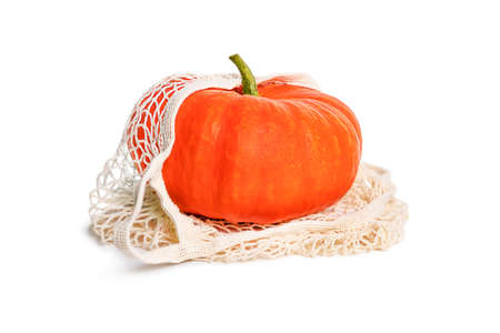 Orange large pumpkin in a grocery bag. isolated objectの写真素材