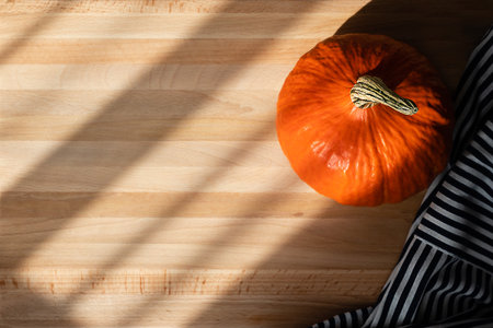Orange pumpkin in the autumn sun. cooking at homeの写真素材