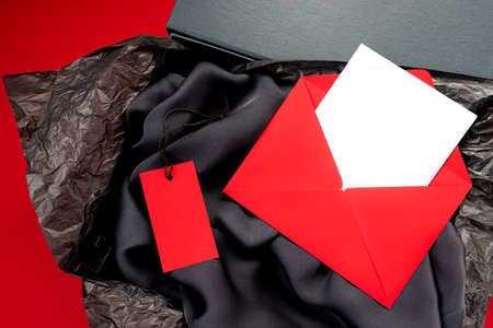 Mockup, red label for text on gray silk shirt and envelope with white paper for text. Beautiful...