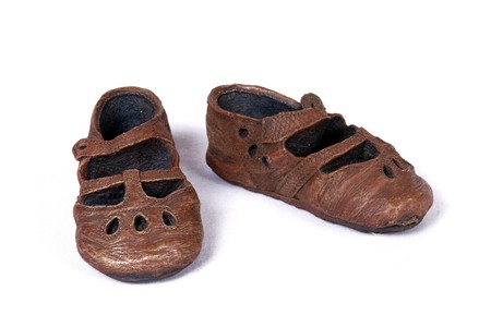 Model of brown children shoes on isolated background 