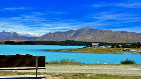Turquoise waters of glacial Lake Tekapo and The Church of Good Shepard. South Island, New Zealandの写真素材
