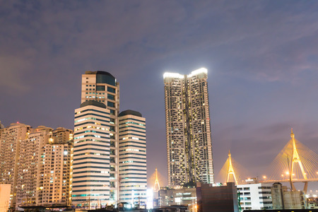 Skyscrapers - office buildings in downtown  at night  backgroundの写真素材