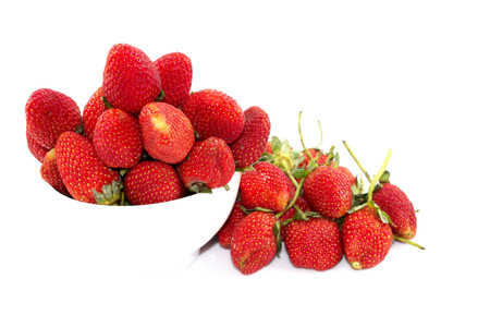 Strawberry, cherry red in white cup on white  backgroundの写真素材
