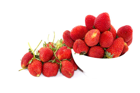 Strawberry, cherry red in white cup on white  backgroundの写真素材
