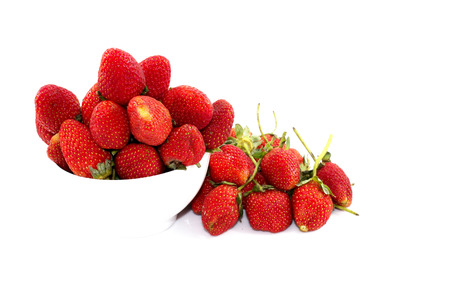 Strawberry, cherry red in white cup on white  backgroundの写真素材