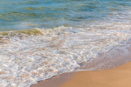 Soft wave of the sea on the sandy beachの写真素材