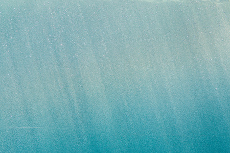 Abstract splashes blue of water on a black backgroundの写真素材