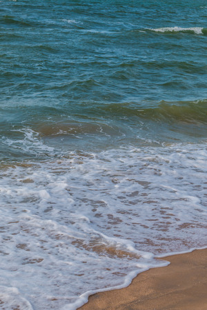 Soft wave of the sea on the sandy beachの写真素材