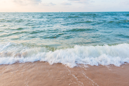 Waves lapping at the beach for backgroundの写真素材