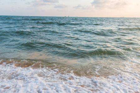 Waves lapping at the beach for backgroundの写真素材