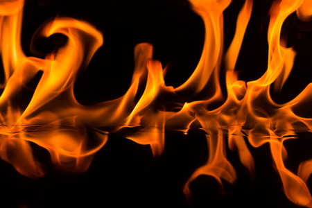 Raging flames on a black backgroundの写真素材