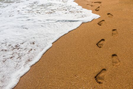 Footprints in the sand for backgroundの写真素材