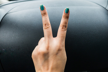 Hand with two fingers for backgroundの写真素材