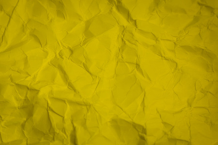 Crumpled yellow paper textureの写真素材