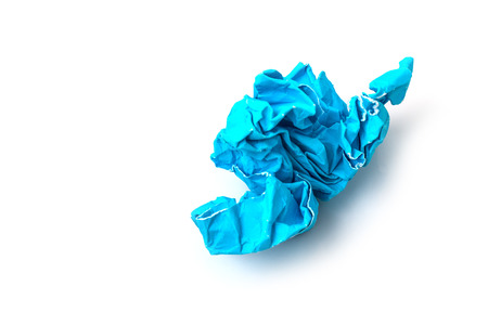 Crumpled blue paper a white background