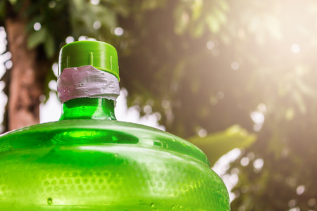 Large water bottle green backgroundの写真素材