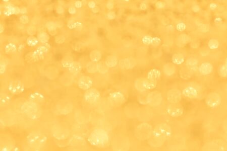 Blur sparkle glitter gold  bokeh  texture christmas abstract backgroundの写真素材