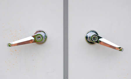 two knobs and grey door
