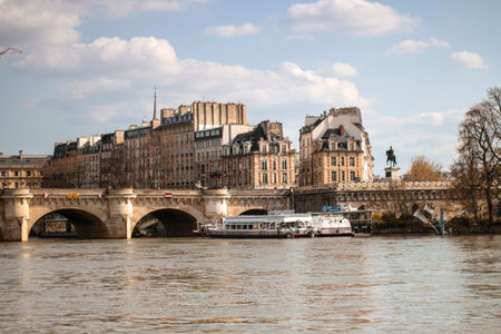 bridge in Seine river with boats and classic buildsのeditorial素材