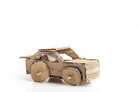 Cardboard or corrugated box car toys on white background. children handcraftの写真素材