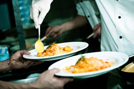 Kitchen plate of noodles are servedの写真素材