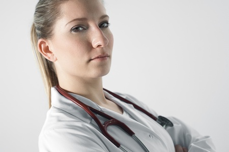 Young female doctor in white roomの写真素材