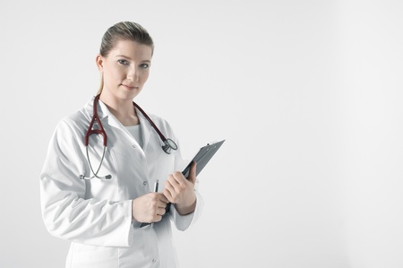 Young female doctor in white roomの写真素材