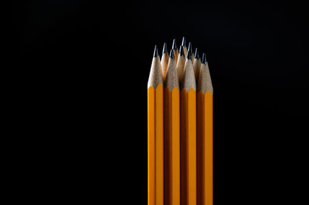group of pencils isolated on pure black backgroundの写真素材