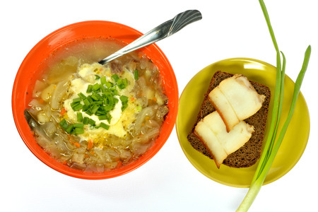 orange plate green cabbage dish sandwich bread with bacon on a white backgroundの写真素材