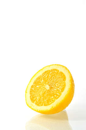 cut in half ripe lemons on a white backgroundの写真素材