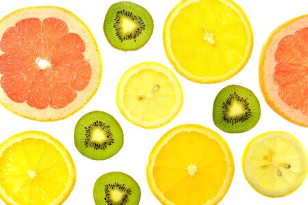 The white background of the different types of citrus orange, lemon, grapefruit and kiwiの写真素材