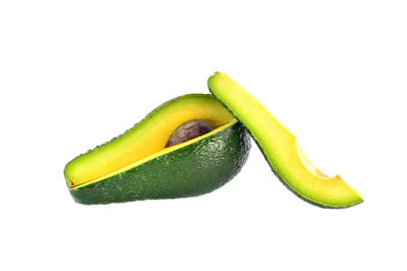 Cut avocado with stones on a white backgroundの写真素材