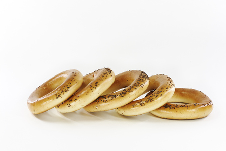 Bagels with poppy seeds on a white backgroundの写真素材