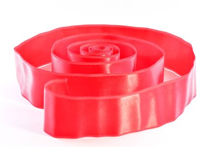 Red satin ribbon on a white backgroundの写真素材