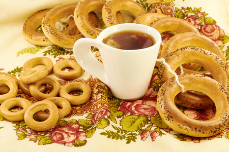 Related bagels with poppy seeds and black teaの写真素材