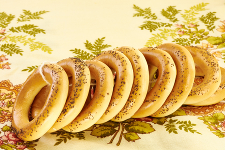 Related bagels with poppy seeds on a napkinの写真素材