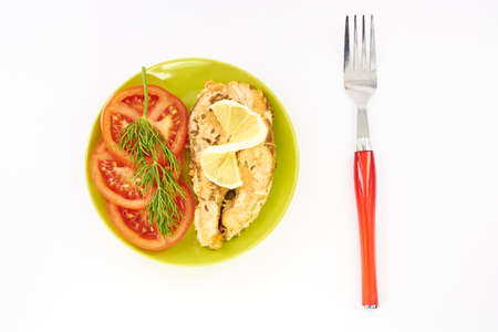 Fish stew and fresh vegetables on a white backgroundの写真素材
