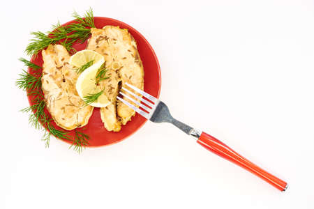 Fish stew in a plate on a white backgroundの写真素材