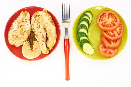 Fish stew and fresh vegetables on a white backgroundの写真素材