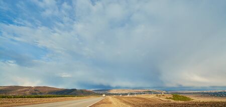 The road to the village in the early springの写真素材