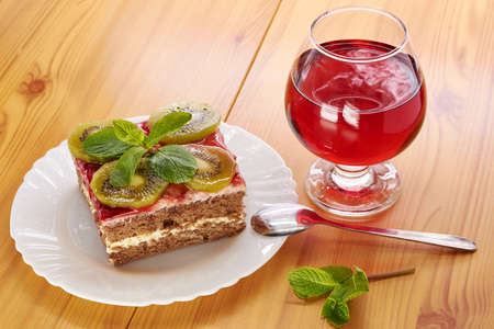 Glass of red wine andGlass of red wine and a dessert of kiwi dessertの写真素材