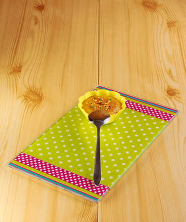 Cinnamon cupcake on a glass cutting board greenの写真素材