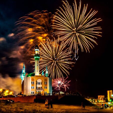 Fireworks in the city on the background of a Muslim mosqueの写真素材