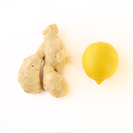 Ginger root and lemon on a white backgroundの写真素材
