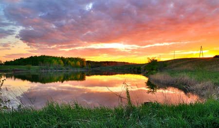Sunset over the river in the summerの写真素材