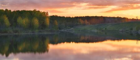 Sunset over the river in the summerの写真素材