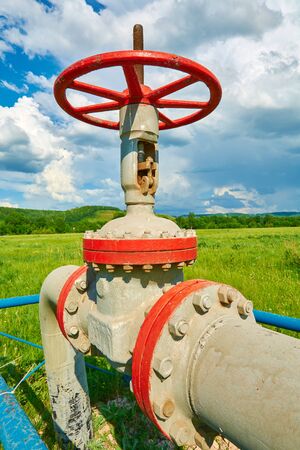 Gas pipe with a tap valve in the summerの写真素材