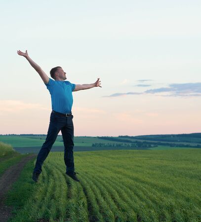 In the jumps of a young man smilingの写真素材