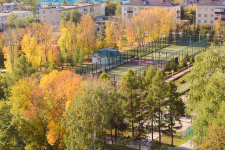 Top view of a tennis court in the park in autumnの写真素材